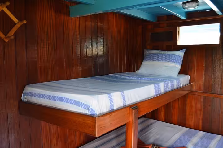 Cozy wooden cabin bunk on Amazon River cruise boat, 6-day upstream journey from Manaus to Tabatinga