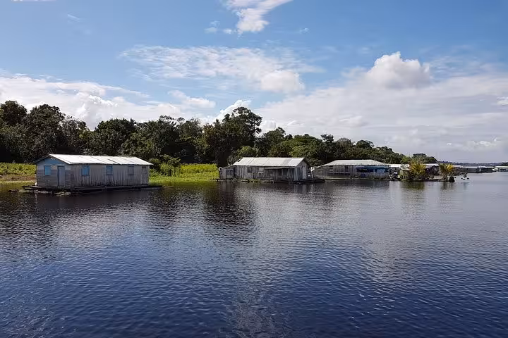 Riverside stilt houses on the Amazon near Manaus, seen during a 4-day Amazon River boat tour in Brazil