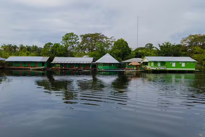 Scenic view of Amazon Tapiri Floating Lodge surrounded by lush jungle and calm waters on the Amazon Jungle tour.