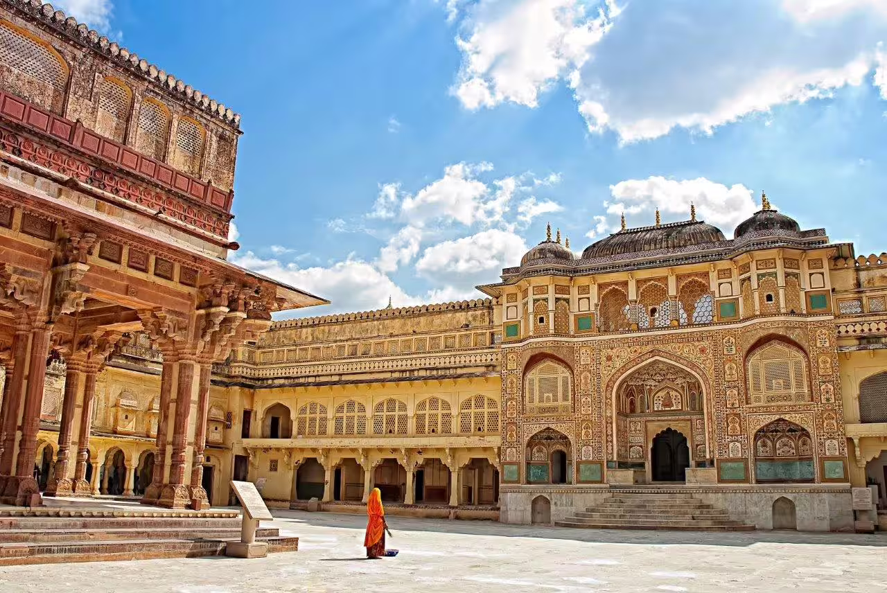 Majestic architecture of Amer Fort under blue skies, a highlight of the Golden Triangle with Udaipur City of Lakes tour.