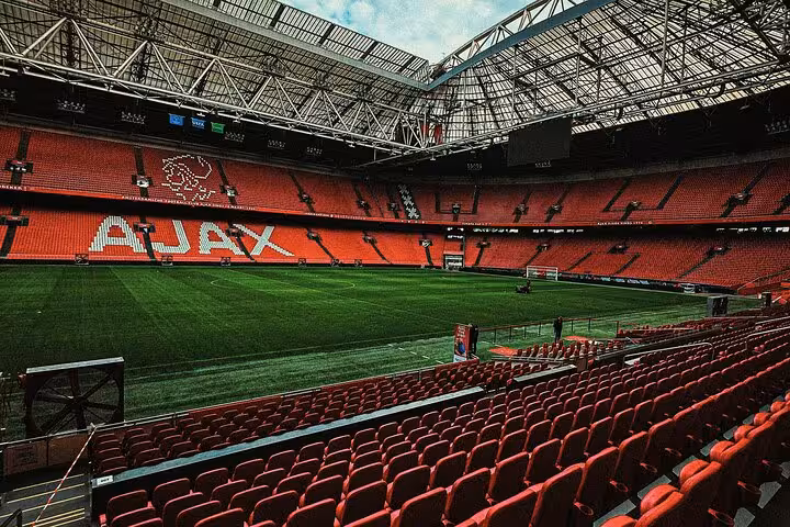 Interior view of Johan Cruijff Arena with Ajax seating and pitch, Amsterdam Ajax match and city highlights tour