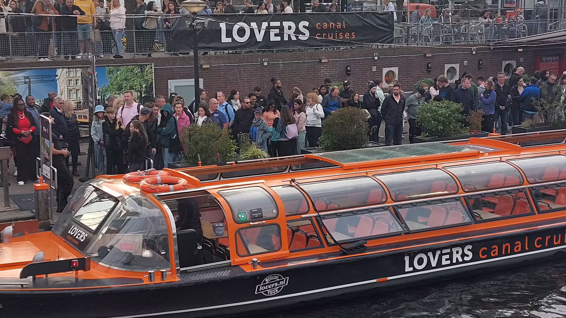 LOVERS Amsterdam canal cruise boat by Central Station, ideal for 4-hour layover tour with Heineken Experience