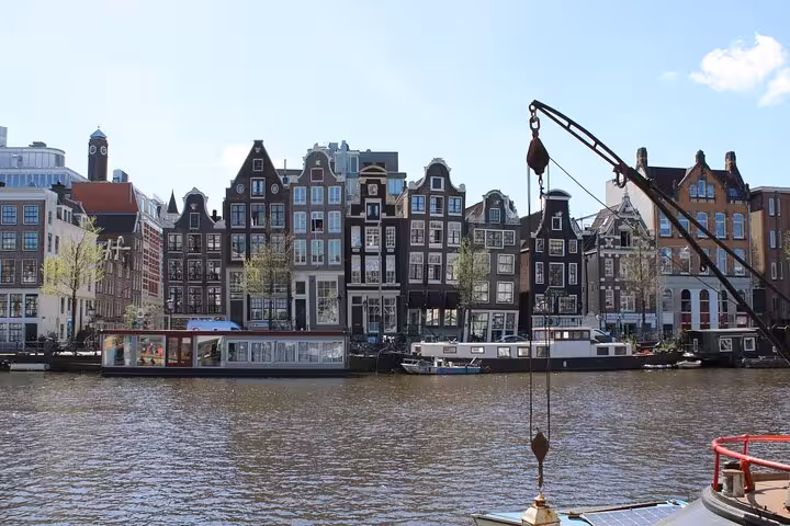 Amsterdam canal houses along the waterfront, perfect scenery on a private city walking experience with a local