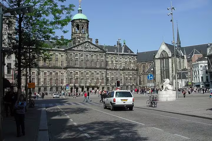 Dam Square in Amsterdam with Royal Palace and Nieuwe Kerk on a sunny day