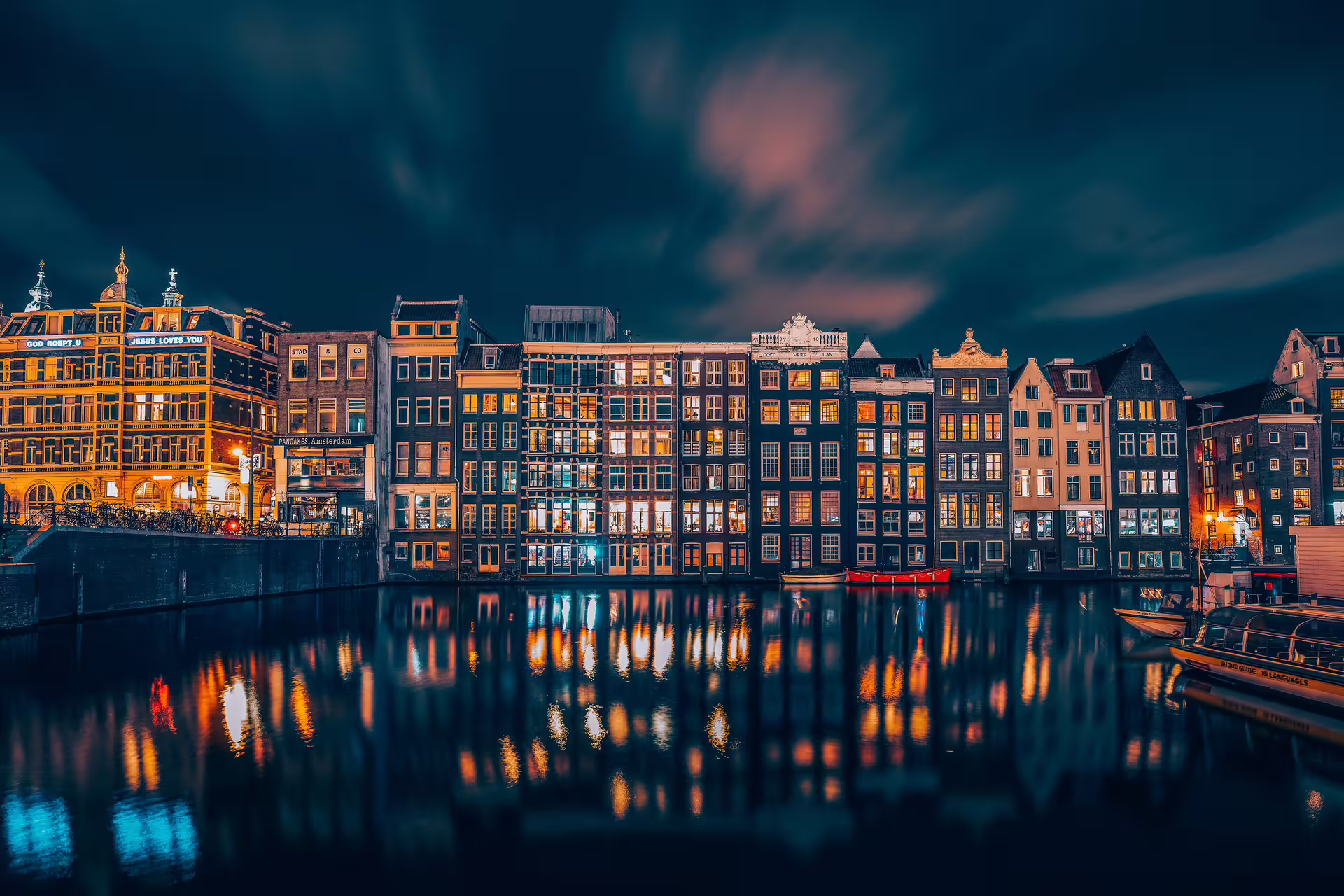 Amsterdam gable houses near central station at nighttime