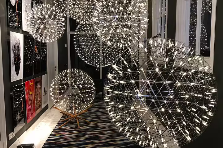 Glowing light-sphere art installation in Amsterdam gallery, perfect stop on Your Own Amsterdam random adventure tour