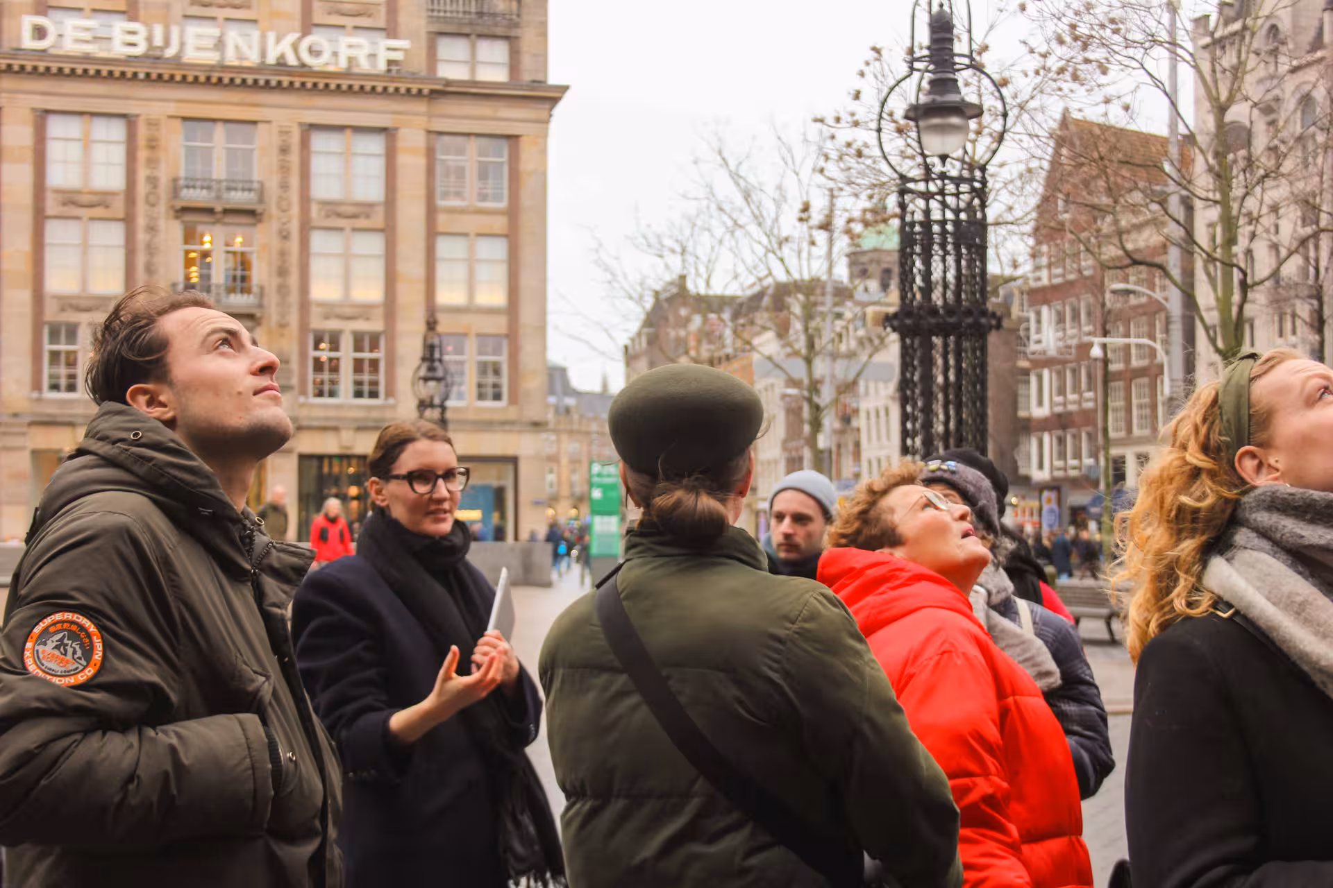 Private Amsterdam layover tour group near Dam Square and De Bijenkorf, guided 3-5 hour city walk