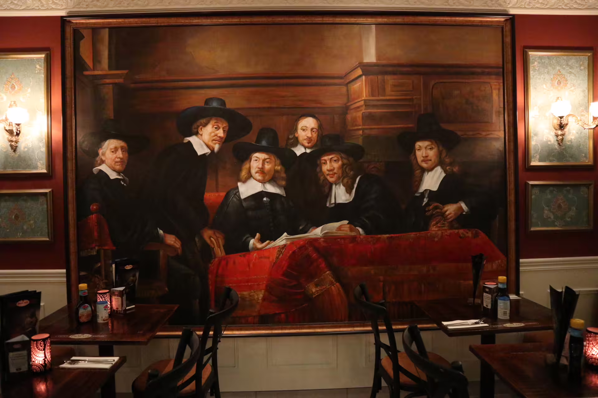 Elegant Amsterdam restaurant interior with historic Dutch painting, perfect for a walking tour stop featuring a pancake lunch.