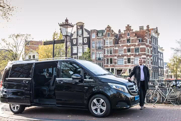 Private chauffeur van in Amsterdam canal district for Schiphol Airport to Nijmegen door-to-door transfer