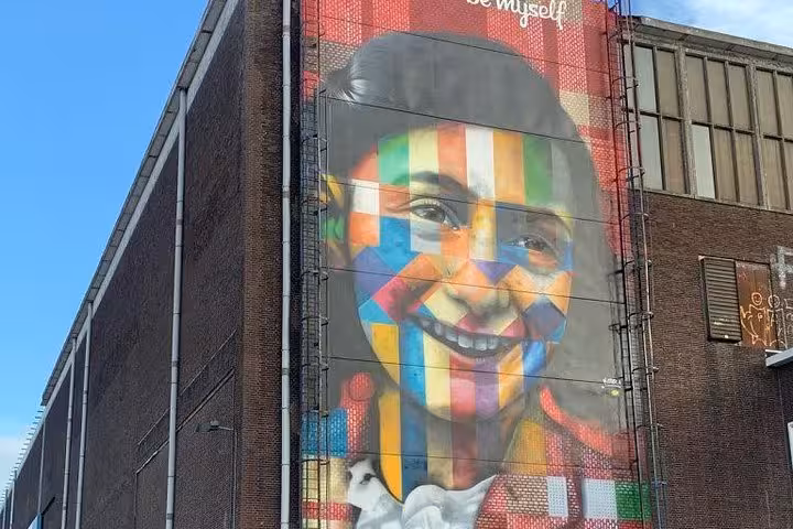 Colorful street art mural in Amsterdam city center, vibrant cultural stop on city and countryside tour