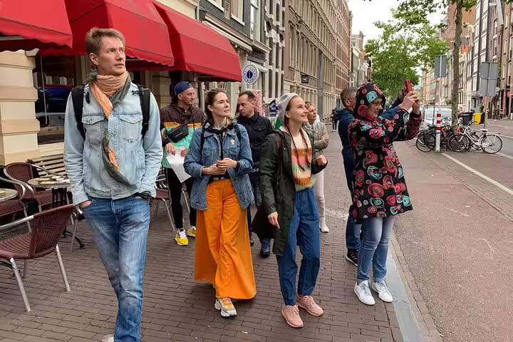 Small group Amsterdam walking tour exploring hidden gems, taking photos and enjoying tastings with PDF guide included