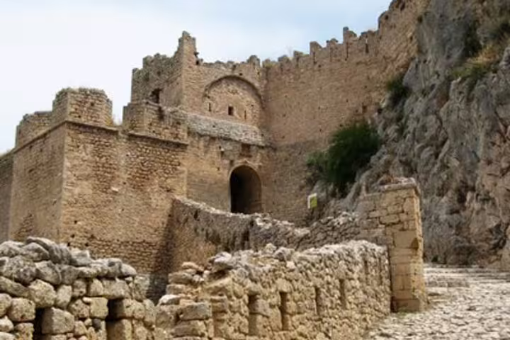 Ancient Corinth Acrocorinth fortress gate and stone path on half-day tour from Athens, Greece