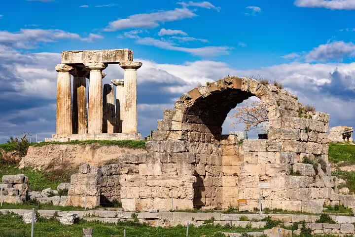 Ancient Corinth ruins with stone arch and temple columns, highlight of Apostle Paul’s footsteps private tour from Athens