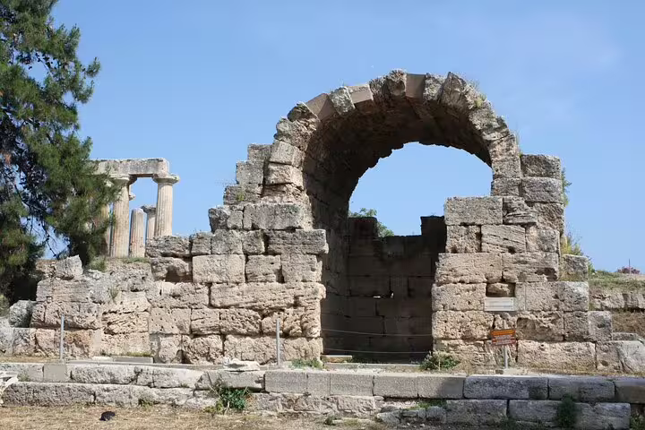 Ancient Corinth ruins stone arch and columns, key heritage stop on Best of Athens and Corinth private tour