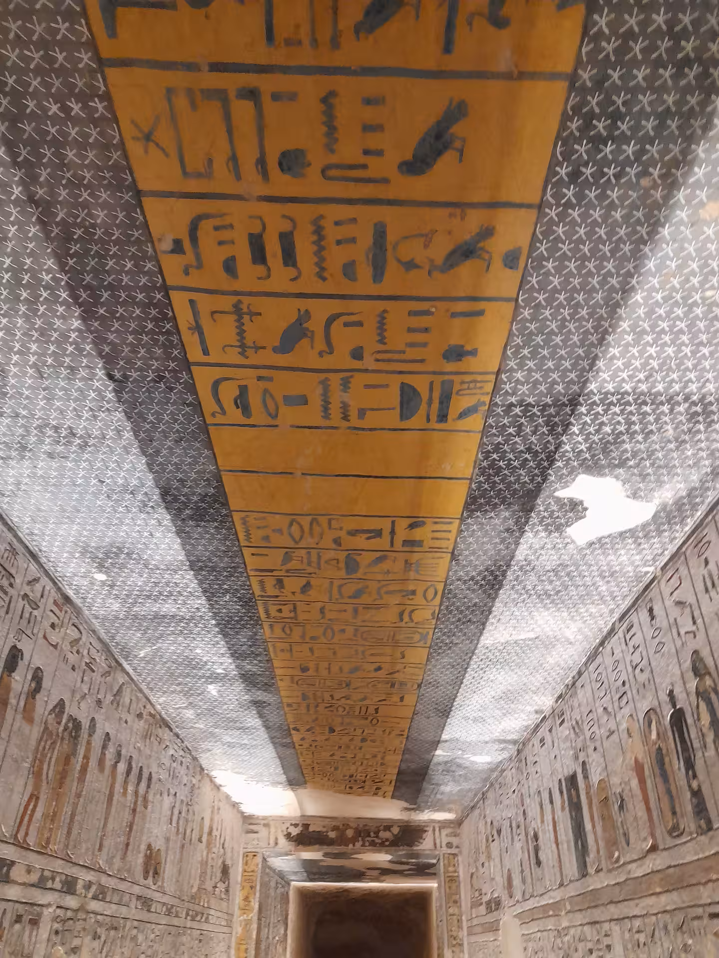 Explore ancient Egyptian hieroglyphs on a vibrant tomb wall, a highlight of our new adventure in Egypt tour.