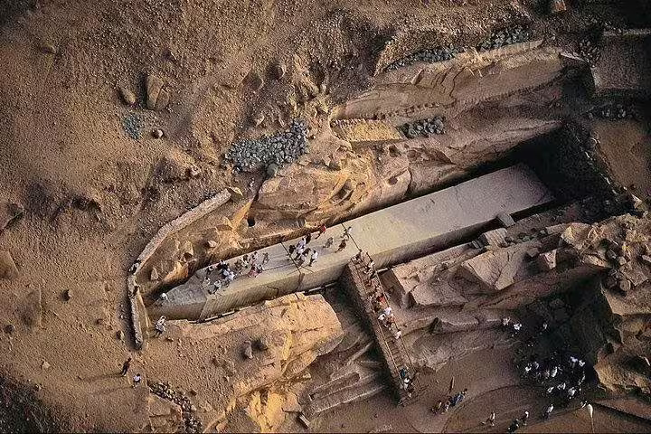 Aerial view of an ancient Egyptian temple carved in desert rock, ideal for Egypt spiritual tour seekers