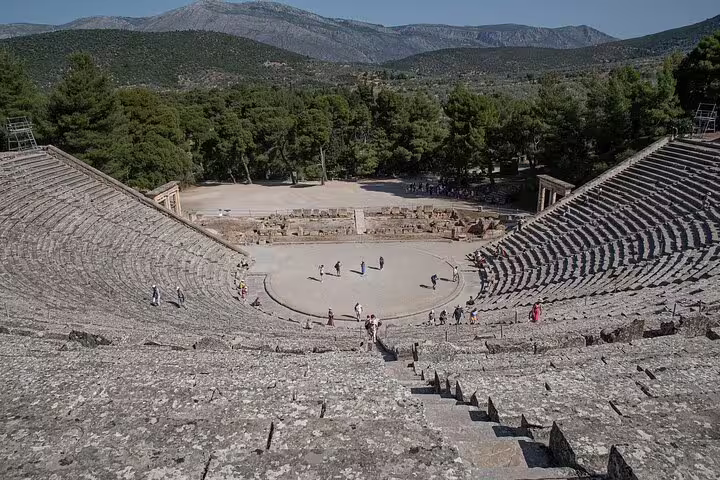 Ancient Epidaurus amphitheater in Greece, offering panoramic views of the surrounding mountains and forests.