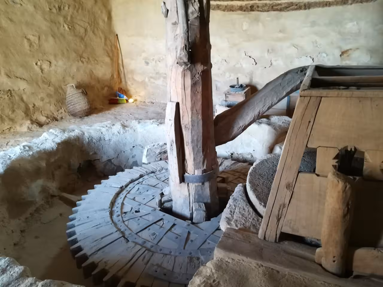 Ancient wooden grain mill mechanism inside a historic Red Sea monastery near Sokhna