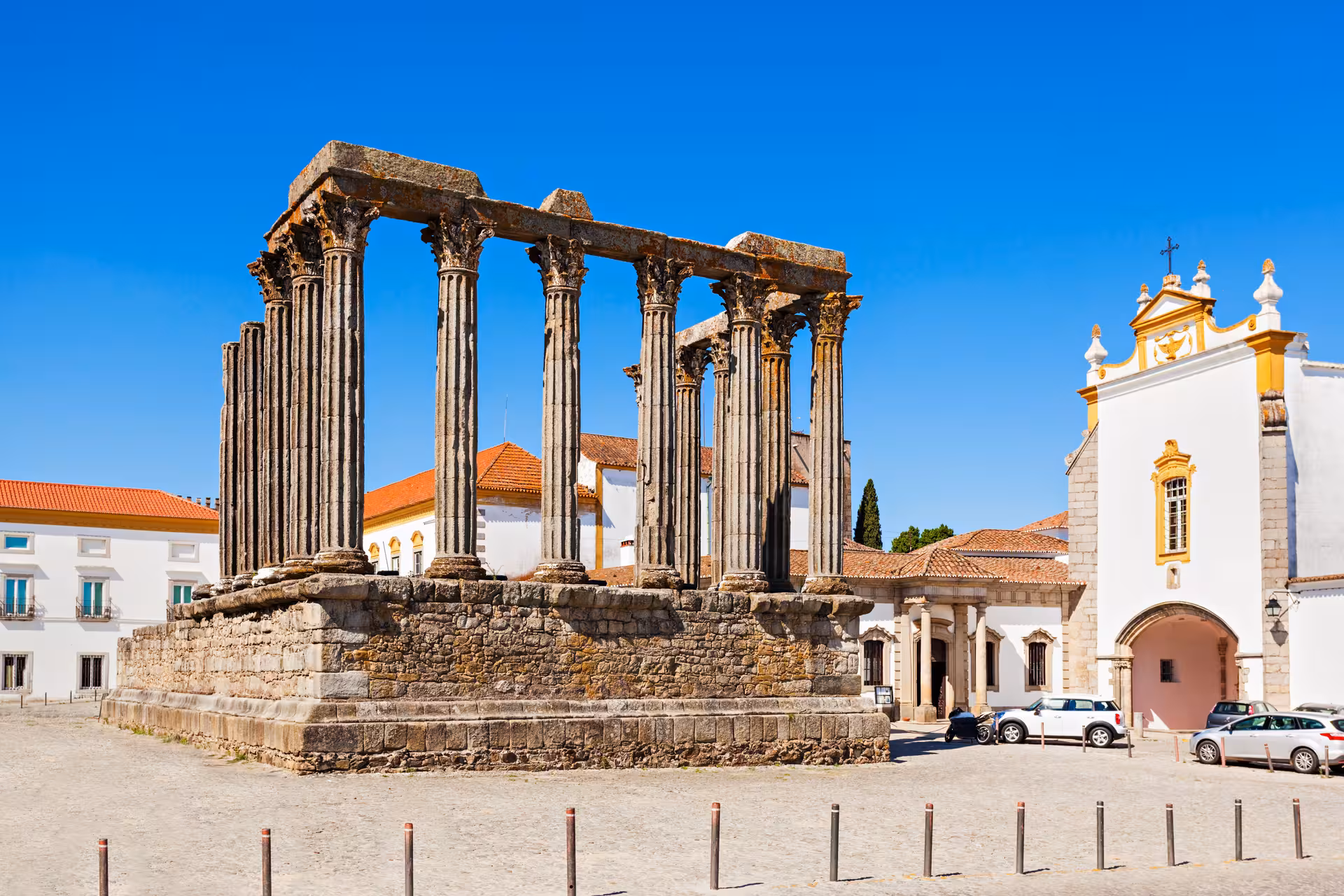Ancient Roman Temple of Évora with clear blue skies on a private guided city tour from Lisbon.