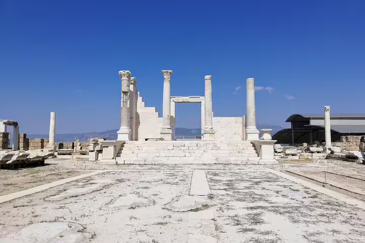 Ancient Sardis ruins with marble columns under blue sky, on 7 Churches of Revelation tour from Istanbul
