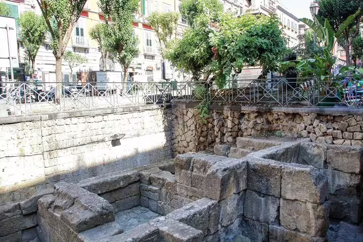 Ancient stone ruins in central Naples, explored on the Legends of Naples superstitions and secrets walking tour