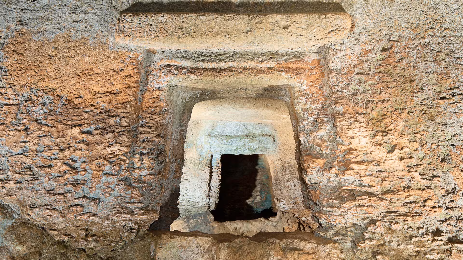 Explore ancient rock-cut chambers at Anghelu Ruju Necropolis in Alghero, featuring detailed audio guide tours.