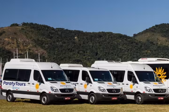 Fleet of Paraty Tours shuttles ready for scenic Angra dos Reis to Paraty journey through lush landscapes.