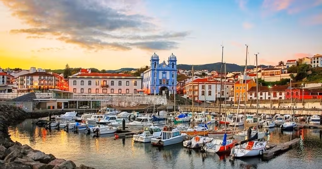 Sunset view of Angra do Heroísmo marina and colorful waterfront, ideal half-day walking tour in Terceira, Azores