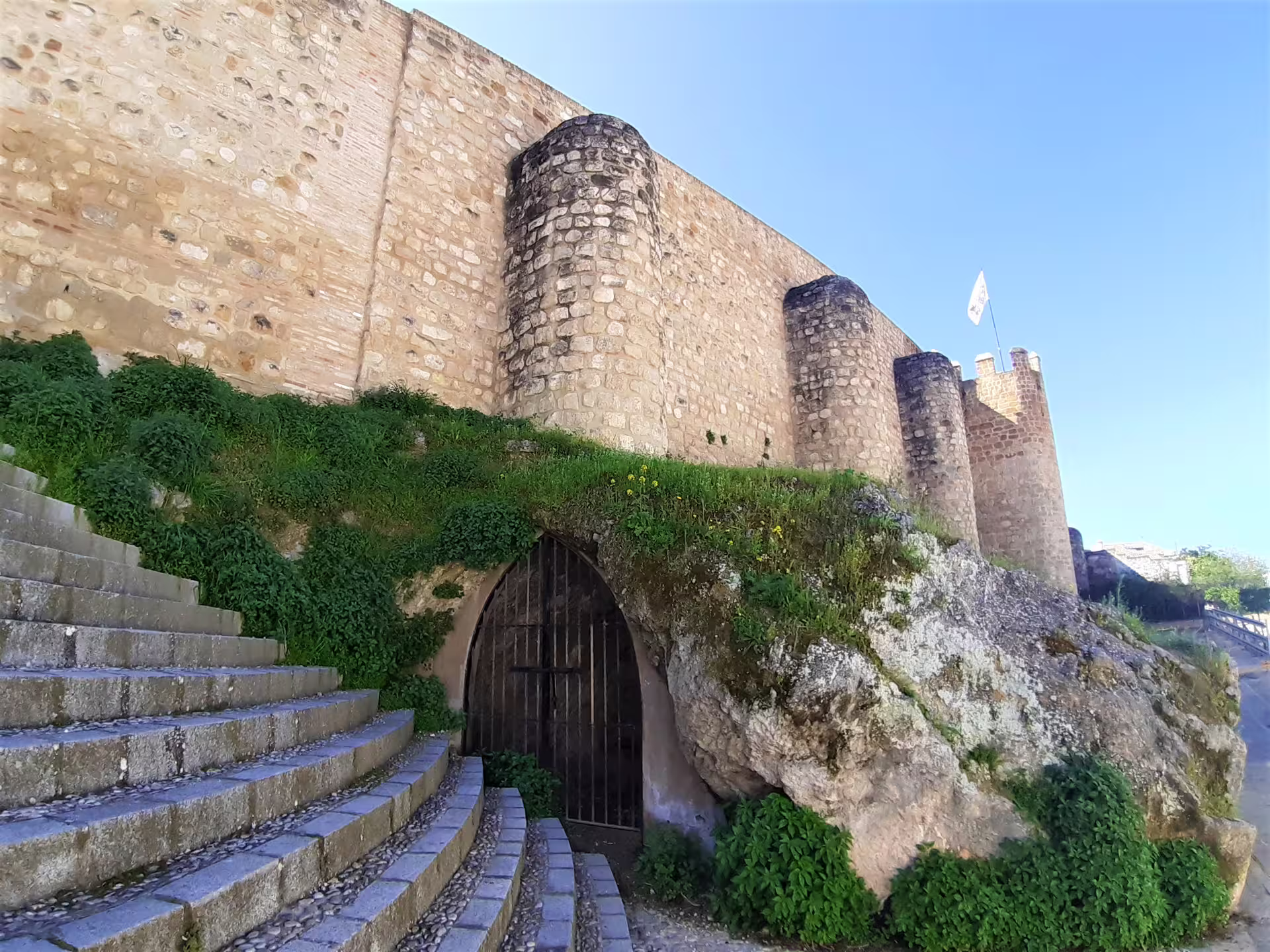 Stone walls and towers of Alcazaba of Antequera, a highlight on a private full-day trip from Costa del Sol