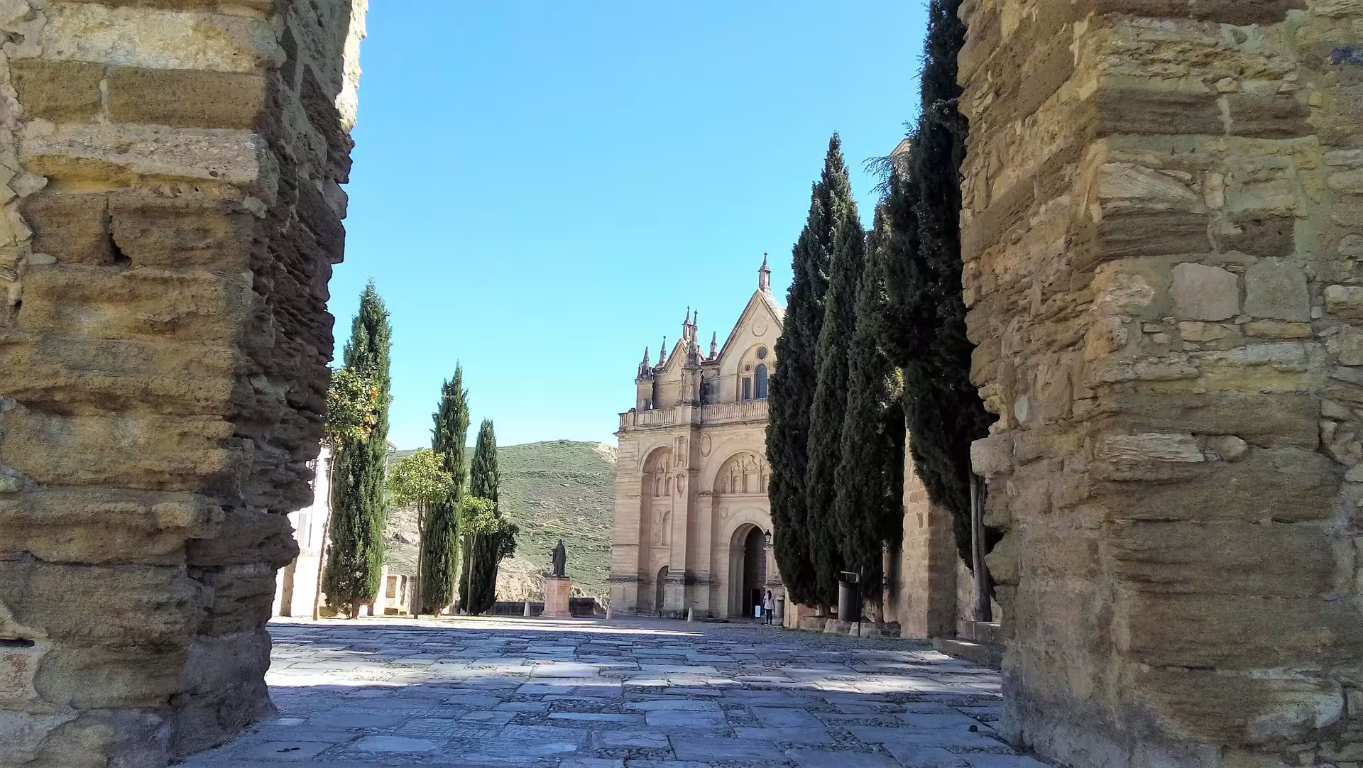 Stone archway view to Real Colegiata de Santa Maria in Antequera on a private Costa del Sol day tour