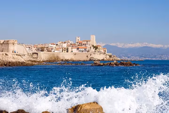 Antibes old town ramparts and turquoise Mediterranean Sea waves on the French Riviera