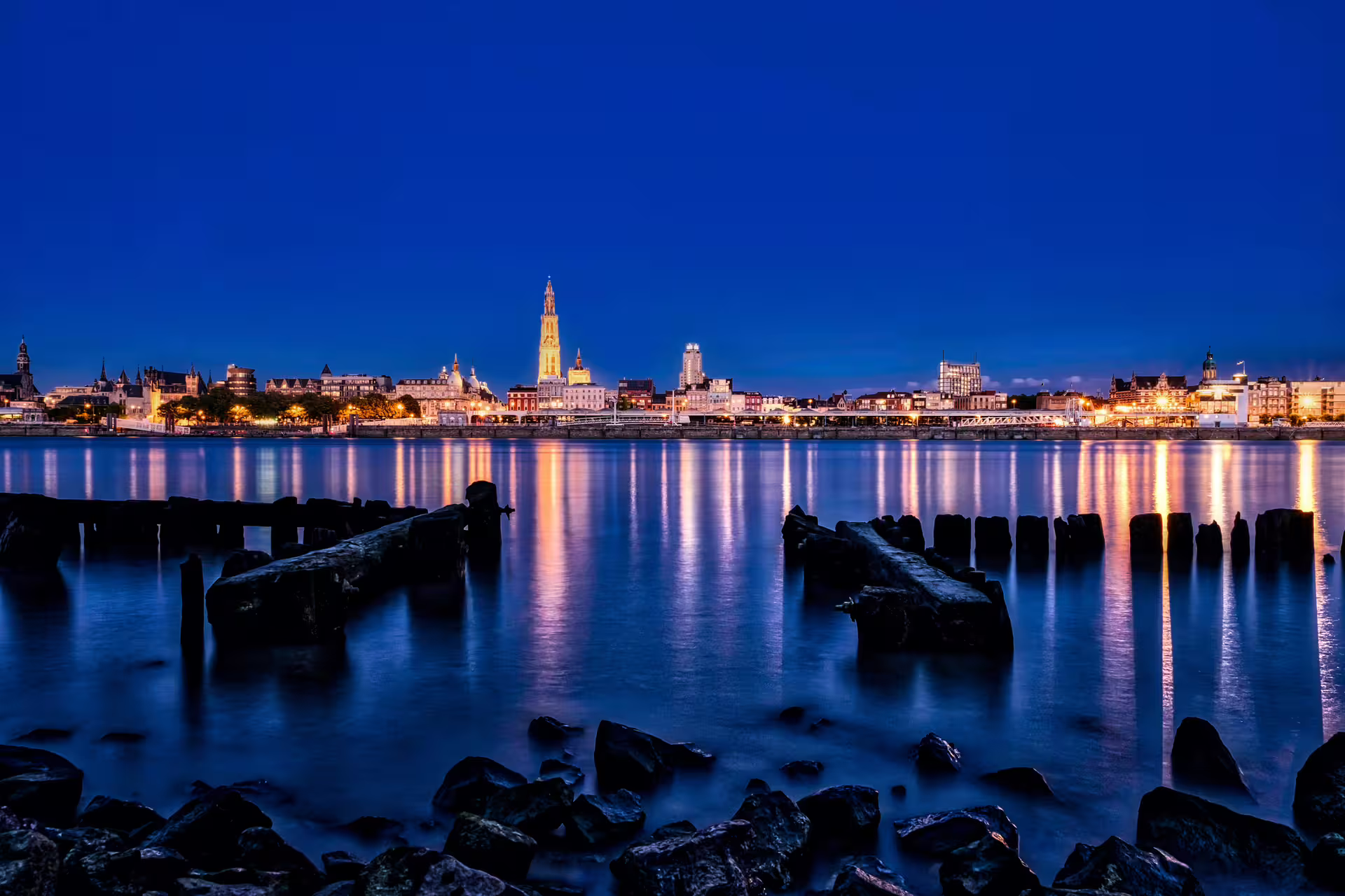 Antwerp skyline at blue hour over the Scheldt River, scenic highlight of Antwerpen 1 Day walking tour