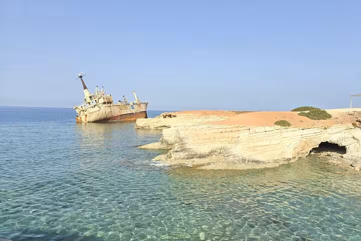 Clear turquoise water by the Edro III shipwreck, a coastal stop on the Aphrodite Experience winery tour