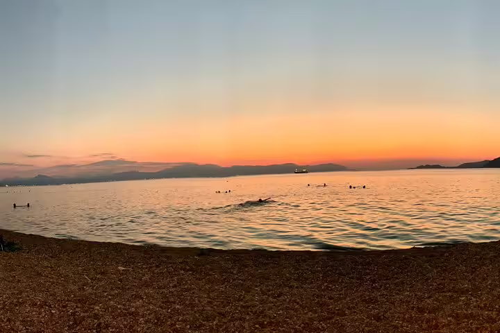 Golden sunset over calm Athens Riviera sea, scenic stop on Apostle Paul’s footsteps half-day private tour