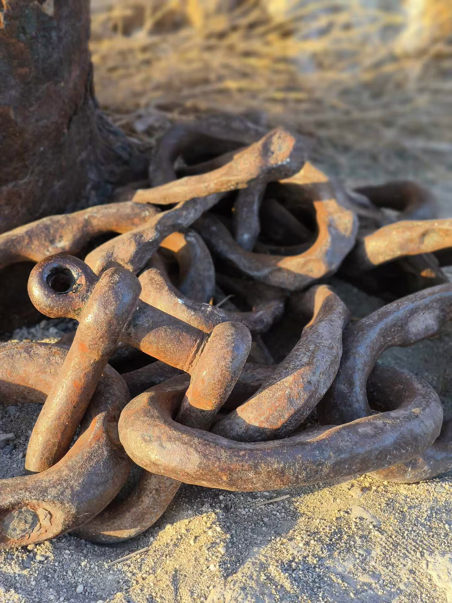 Close-up of weathered maritime chains in Chania, highlighting the rich history on the Aptera tour.