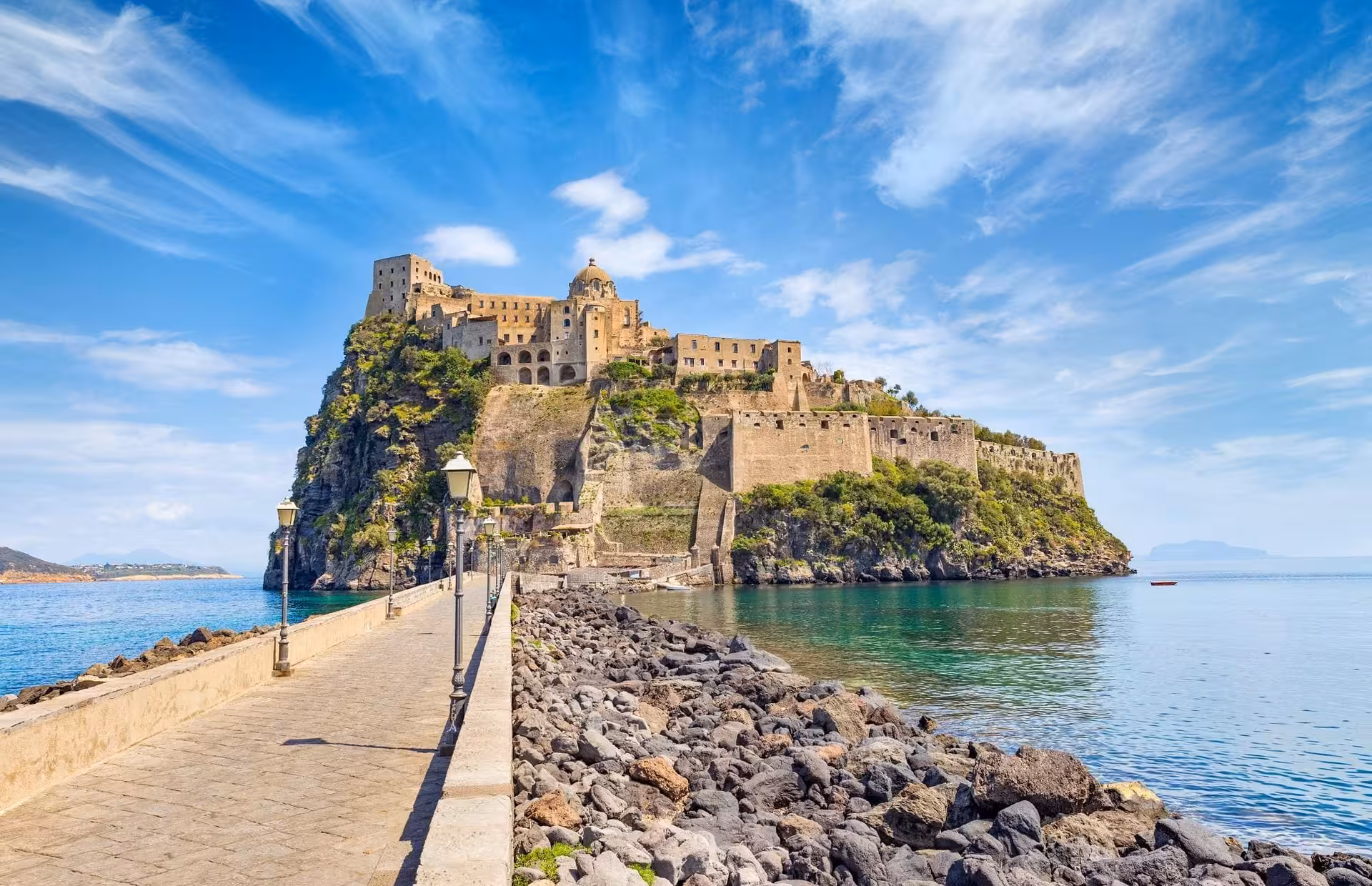 Aragonese Castle Ischia seen from the stone causeway, highlight of guided Italian tour with sea views