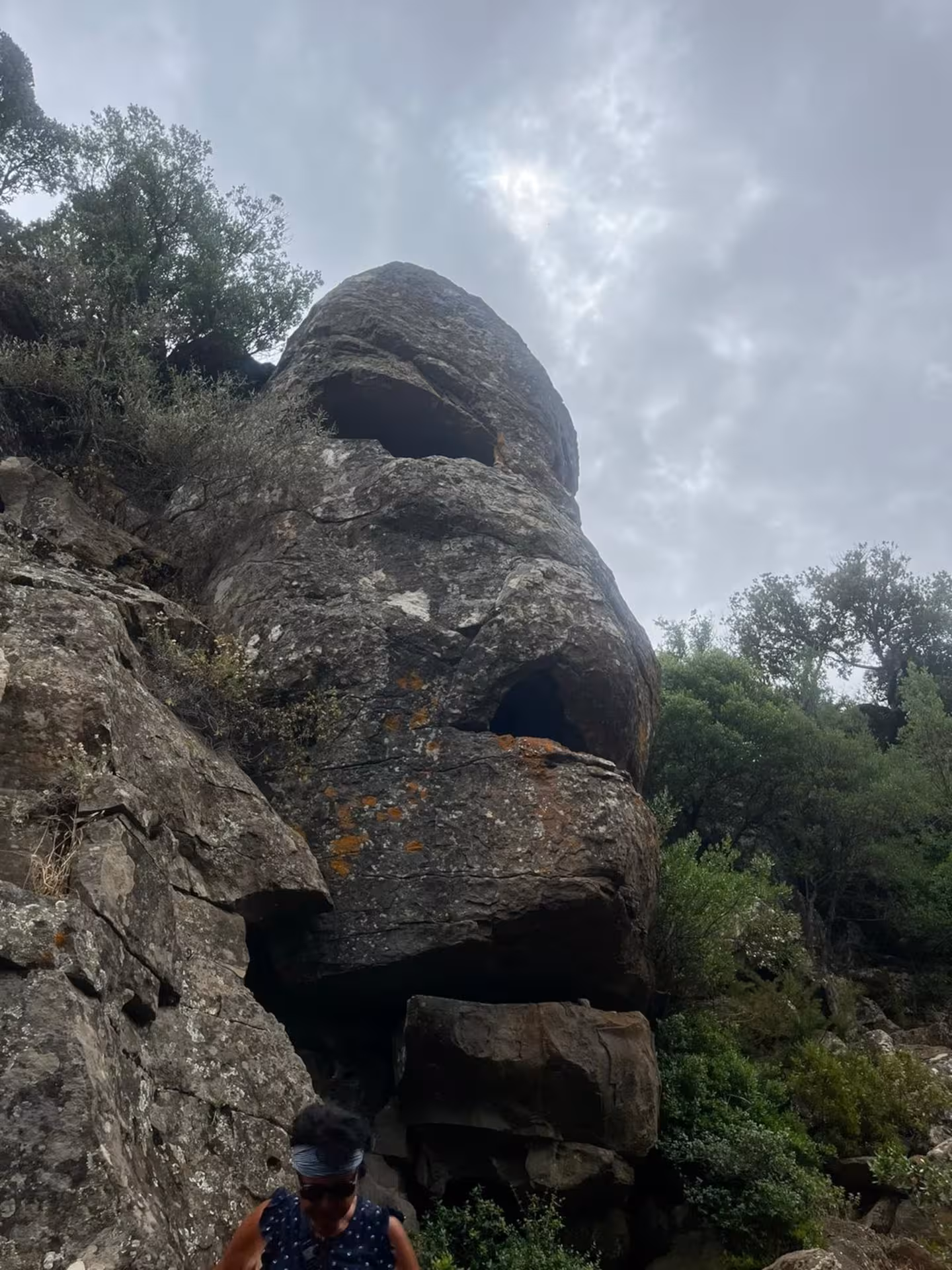 Majestic rock formations on the Golgo Plateau during a jeep tour from Arbatax, surrounded by lush greenery.