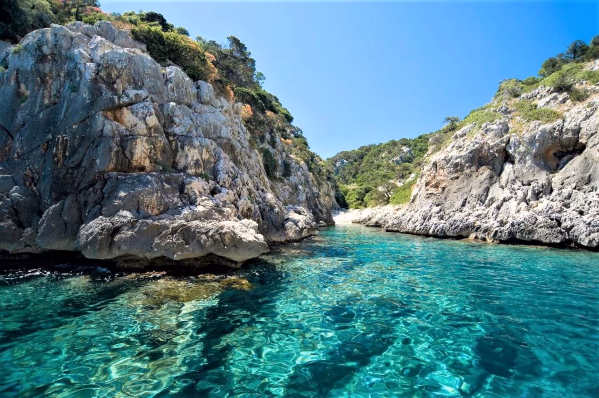 Navigate through the clear turquoise waters surrounded by dramatic cliffs on the Arbatax RIB tour.