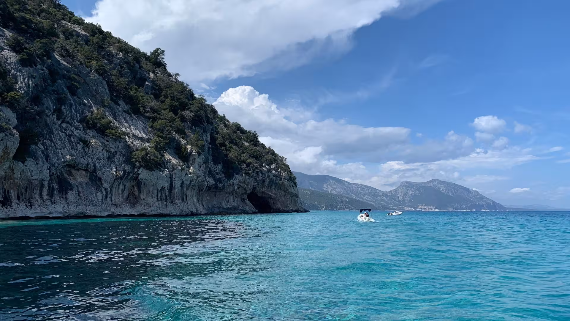 View of Cala Luna's turquoise waters and rugged coastline, ideal for a thrilling Arbatax RIB excursion.