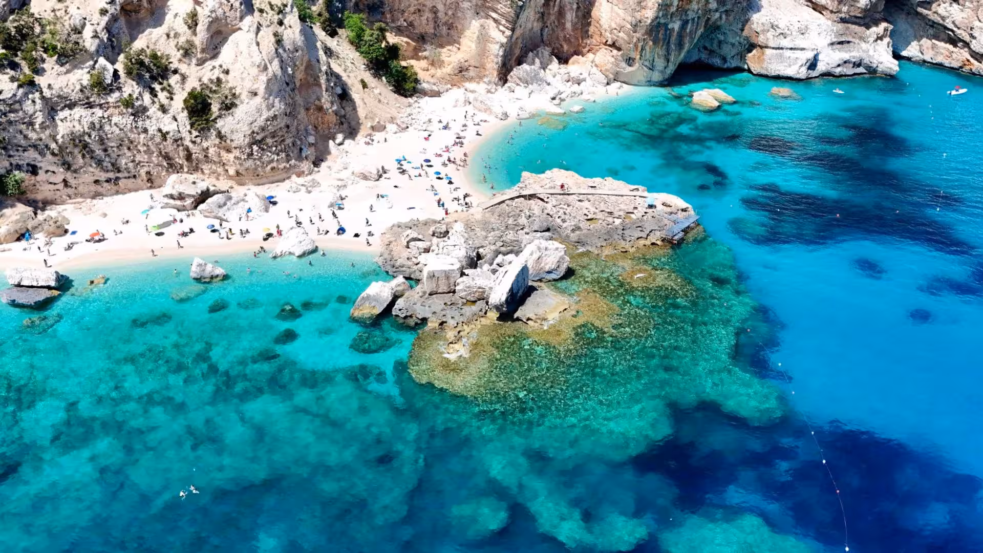 Aerial view of pristine beach and turquoise waters in the Gulf of Orosei, perfect for sailing trips.