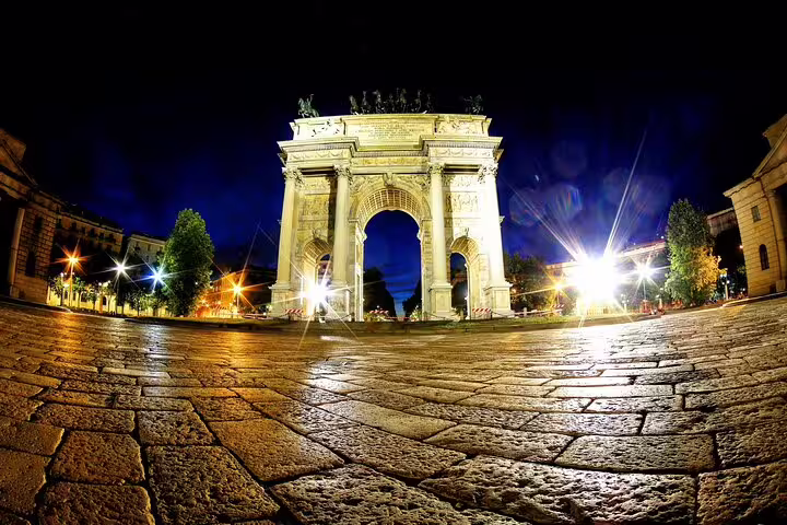 Night view of Arco della Pace in Milan, illuminated beautifully, showcasing its grandeur on a private night tour.