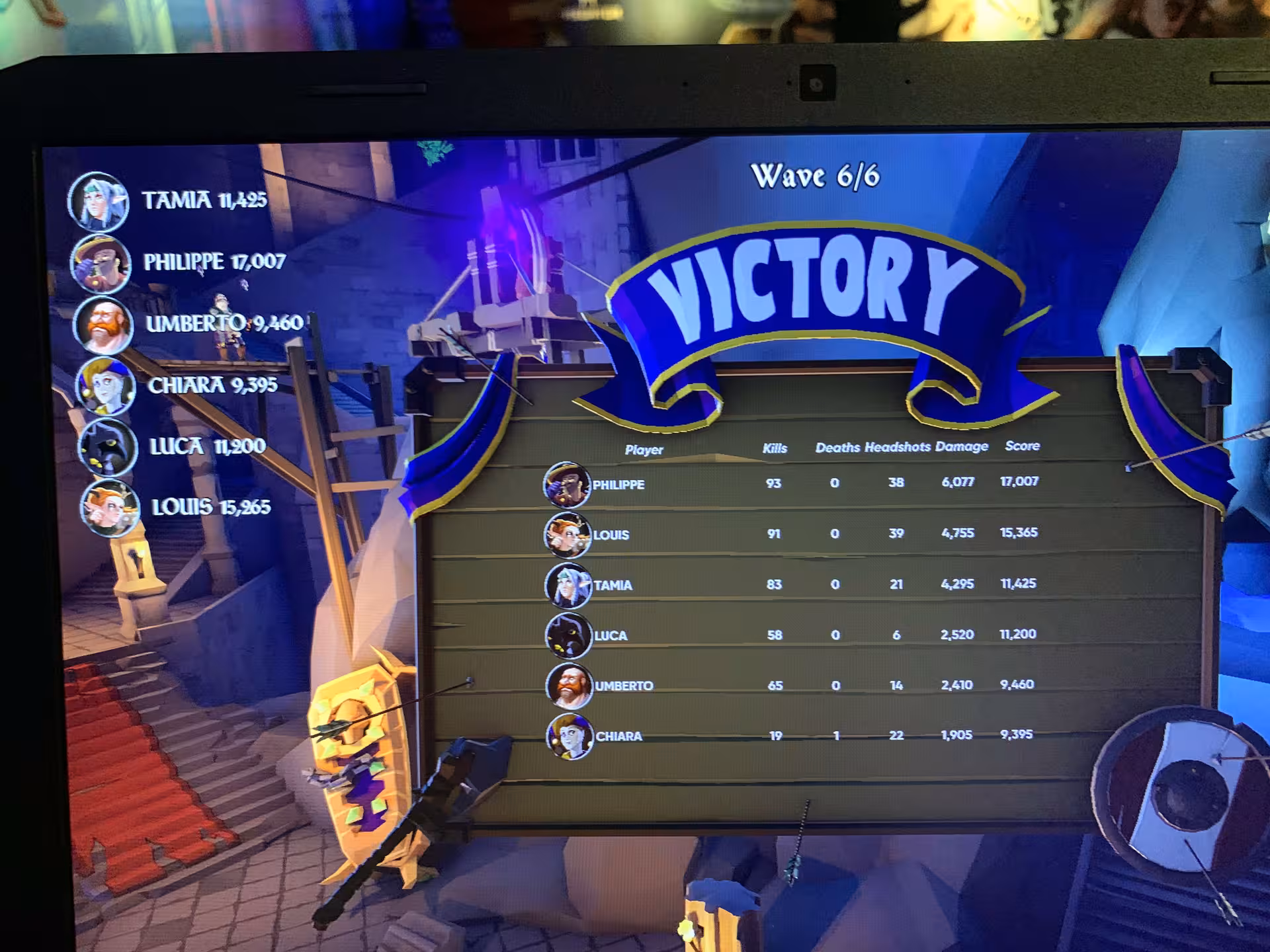 Arena 25 VR game victory screen showing team scoreboard and Wave 6/6 completion on gaming monitor