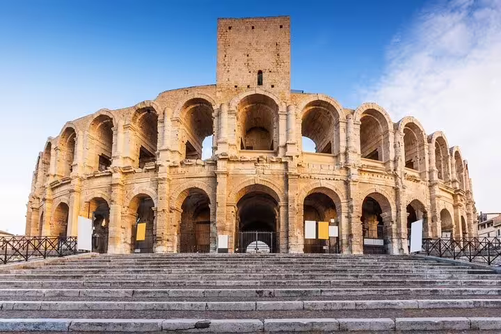 Roman amphitheater of Arles with two-tiered stone arches and grand staircase, Provence, France