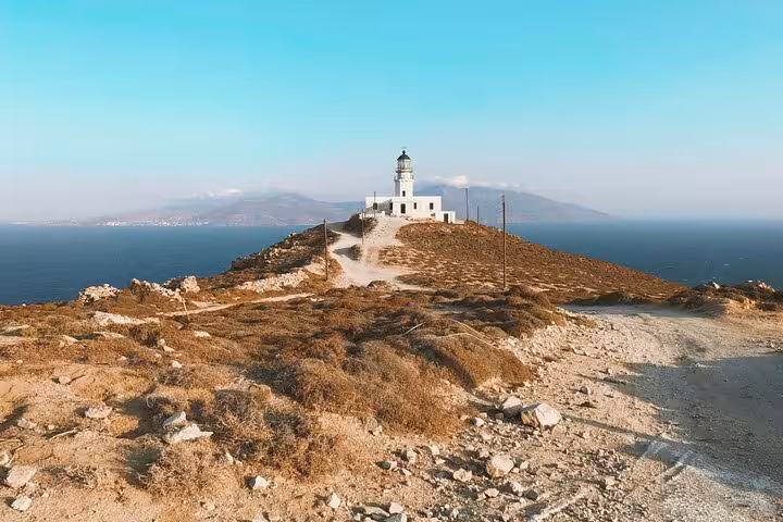 Armenistis Lighthouse Mykonos overlooking the Aegean, a scenic stop on the Best of the Island tour