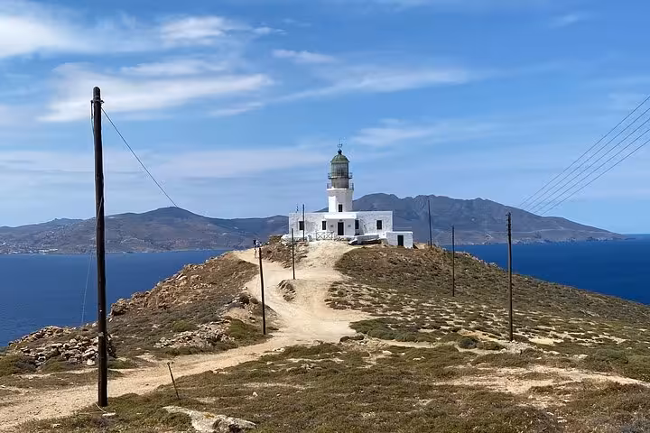 Armenistis Lighthouse viewpoint on Mykonos private highlights tour, scenic cliff path above the Aegean Sea