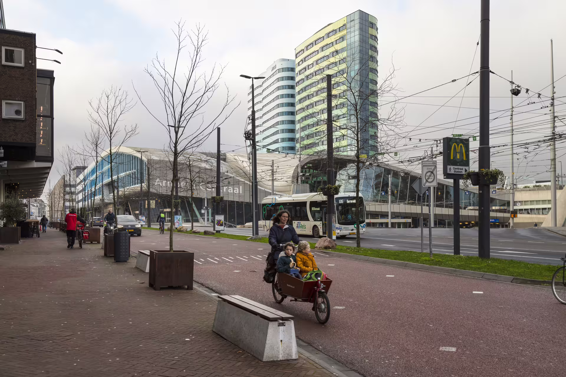 Arnhem Centraal Station and modern skyline with cyclists, ideal start point for 1-day walking tour with audioguide