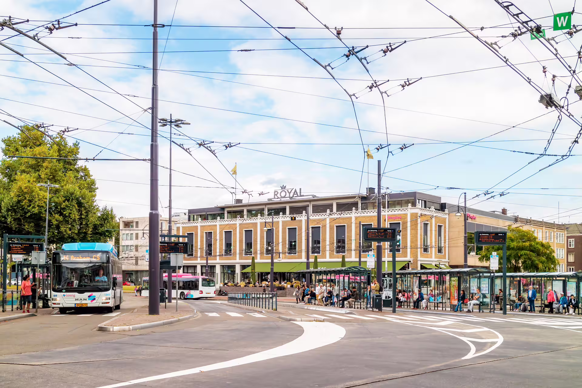 Arnhem city center bus and tram stop near Royal building, key stop on 1-day walking tour audioguide