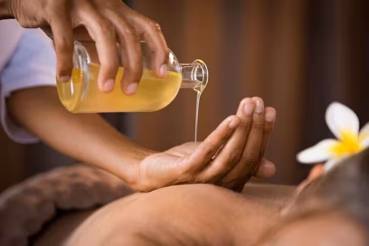 Aromatherapy oil poured for relaxing massage at Hurghada Cleopatra Deluxe Spa with sauna and jacuzzi access