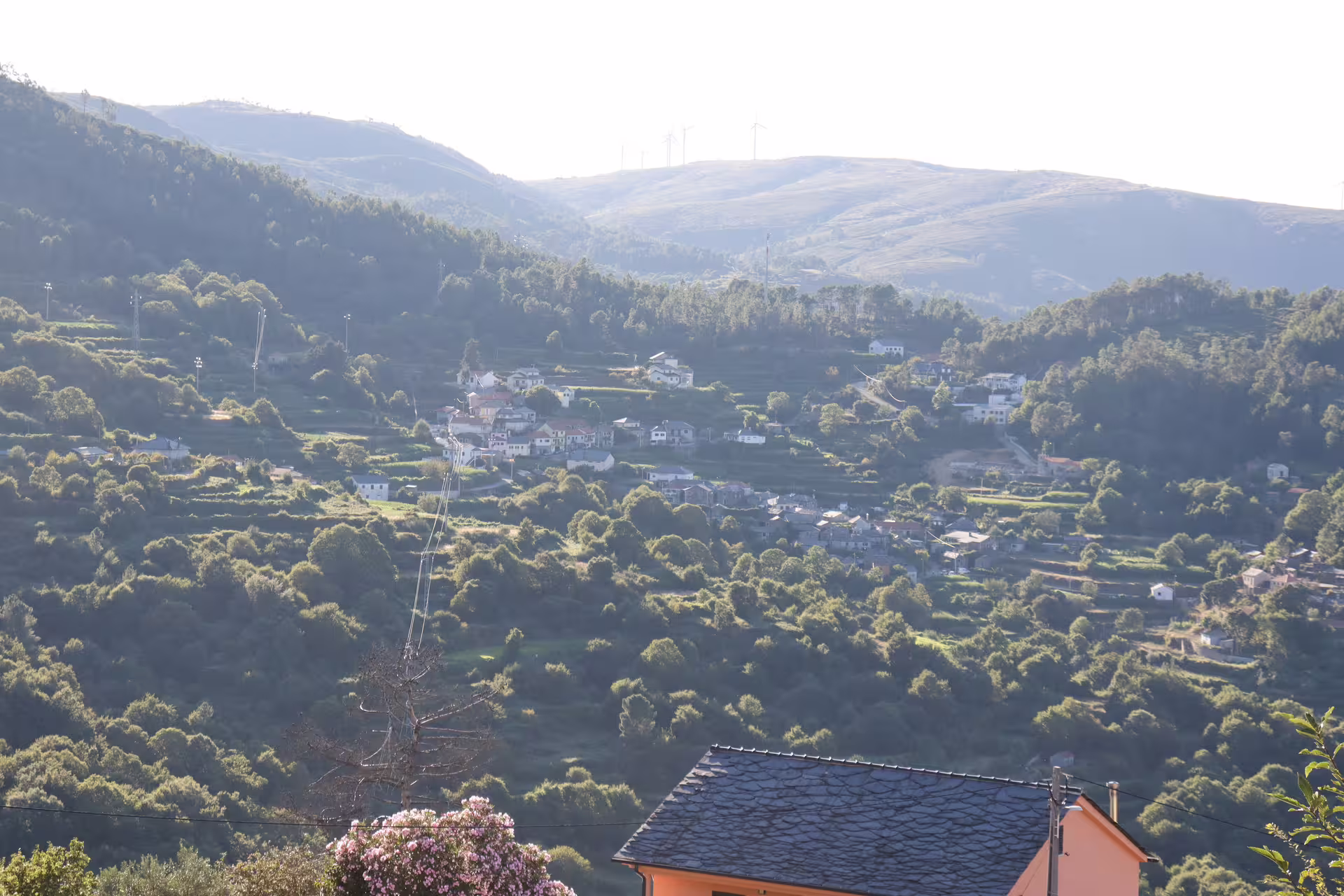 Scenic view of lush green hills and quaint village near Arouca 516 Bridge and Paiva Walkways, perfect for a private nature tour.