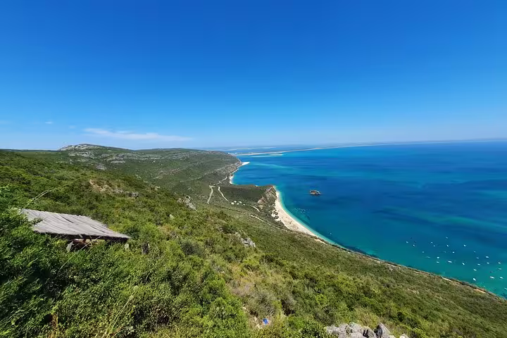 Breathtaking panorama of the Arrábida coastline with expansive ocean views and green landscapes, ideal for nature lovers.